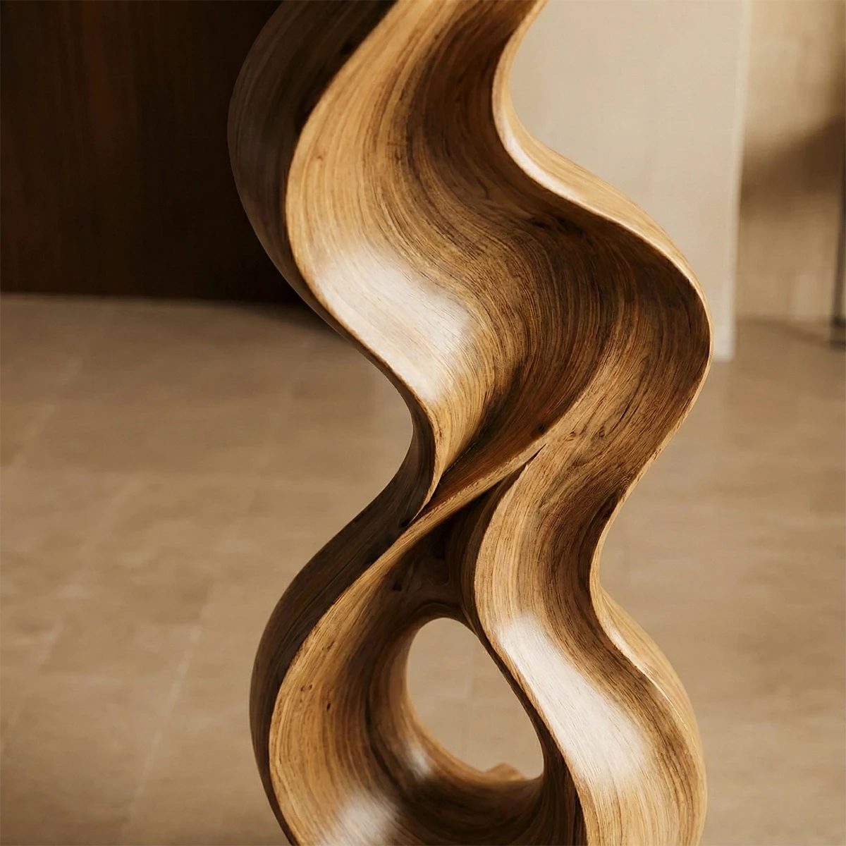 Contemporary abstract sculpture with dynamic curves and rich walnut tone finish artistic presence