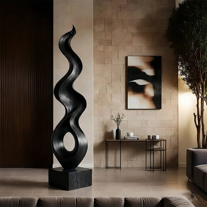 Organic modern sculpture displaying elegant twisting lines and warm black tone finish style
