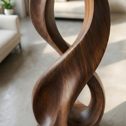 Modern abstract floor sculpture showcasing twisted loop silhouette and walnut tone finish detail