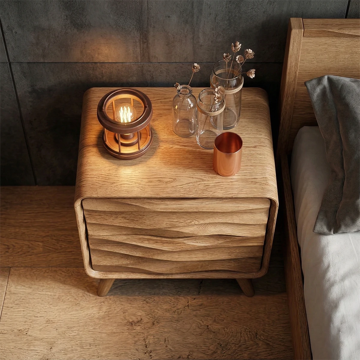 Compact bedroom storage unit designed with sculptural layers and smooth oak tone finish