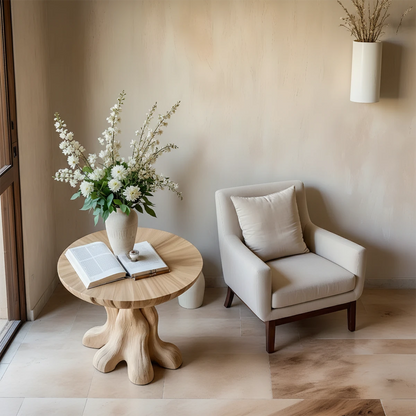 Featuring a light oak tone side table with curved shape and practical shelf for decor