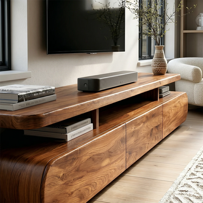Wide TV cabinet with integrated shelf and natural wood look in bright contemporary space