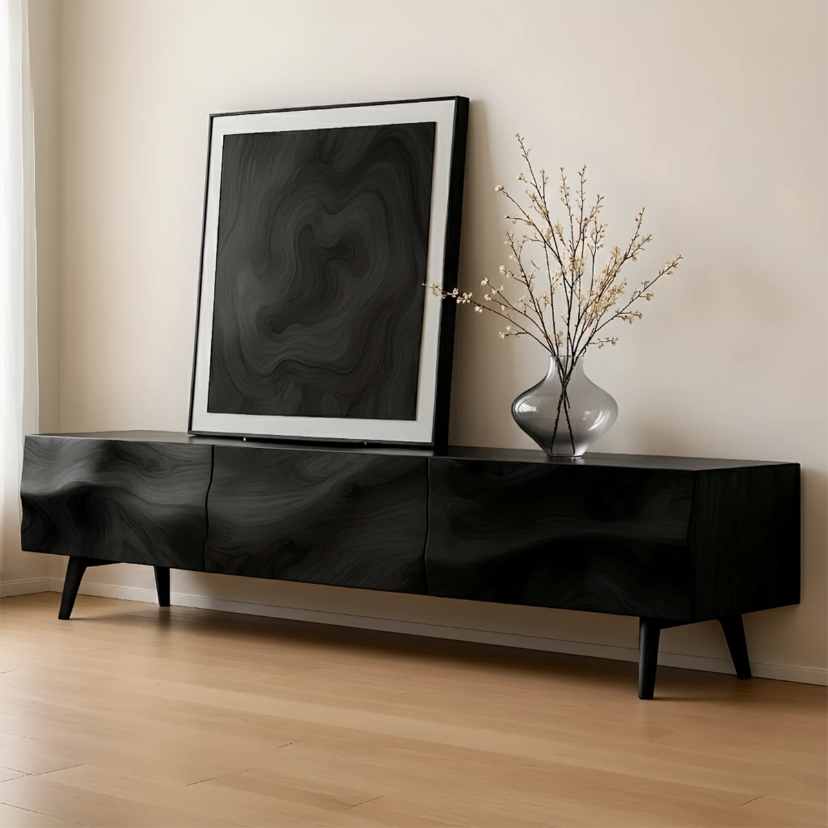 Black finish TV stand with clean lines and flowing grain pattern in a contemporary living room