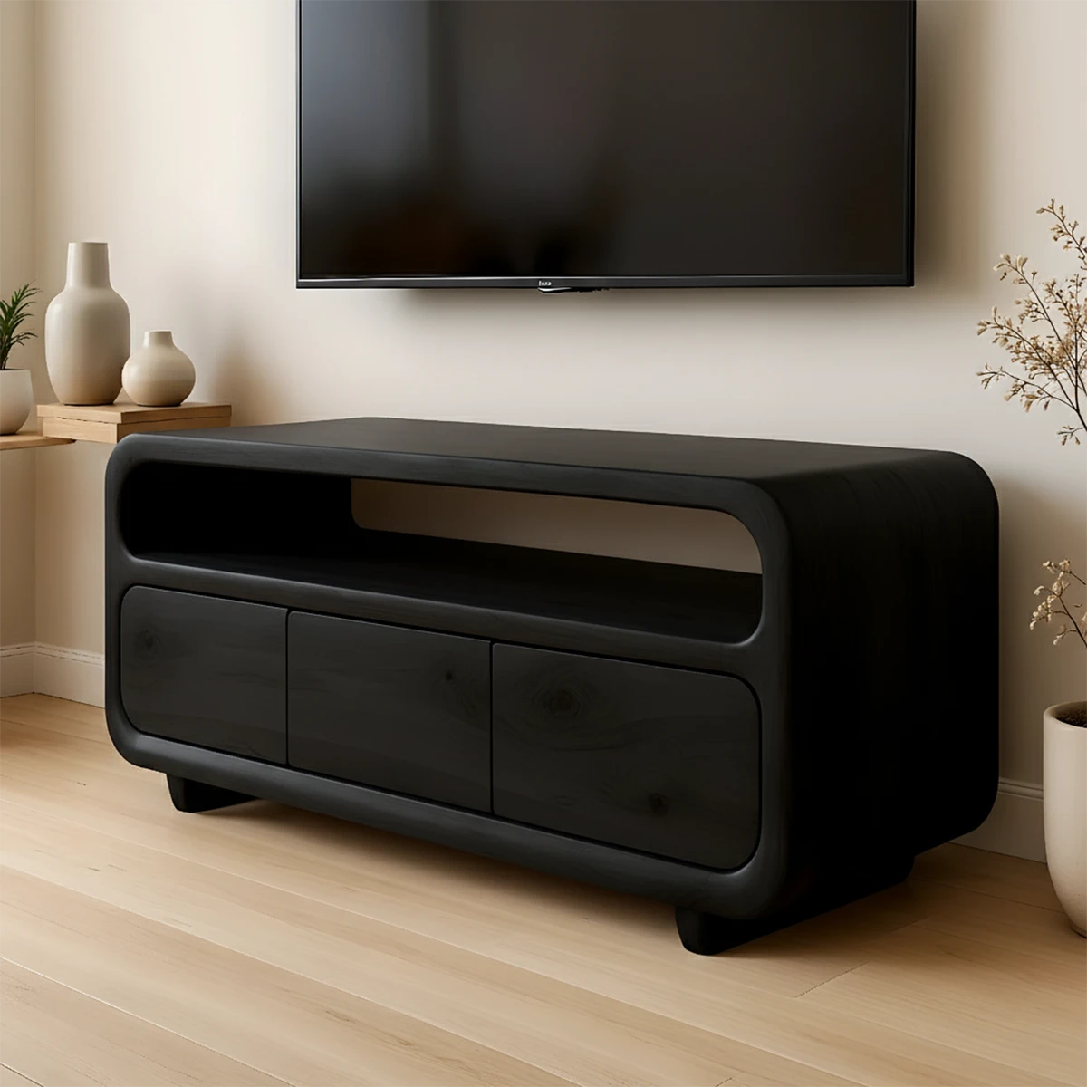 Dark black TV stand with low profile design and natural grain visual in a bright space