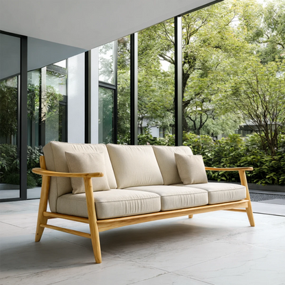 Bright interior showcases a fabric sofa with natural wood frame and balanced minimalist proportions
