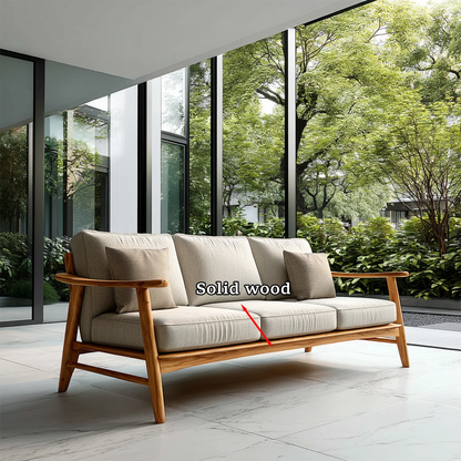 Refined contemporary sofa with fabric seating and natural wood detailing beside panoramic windows