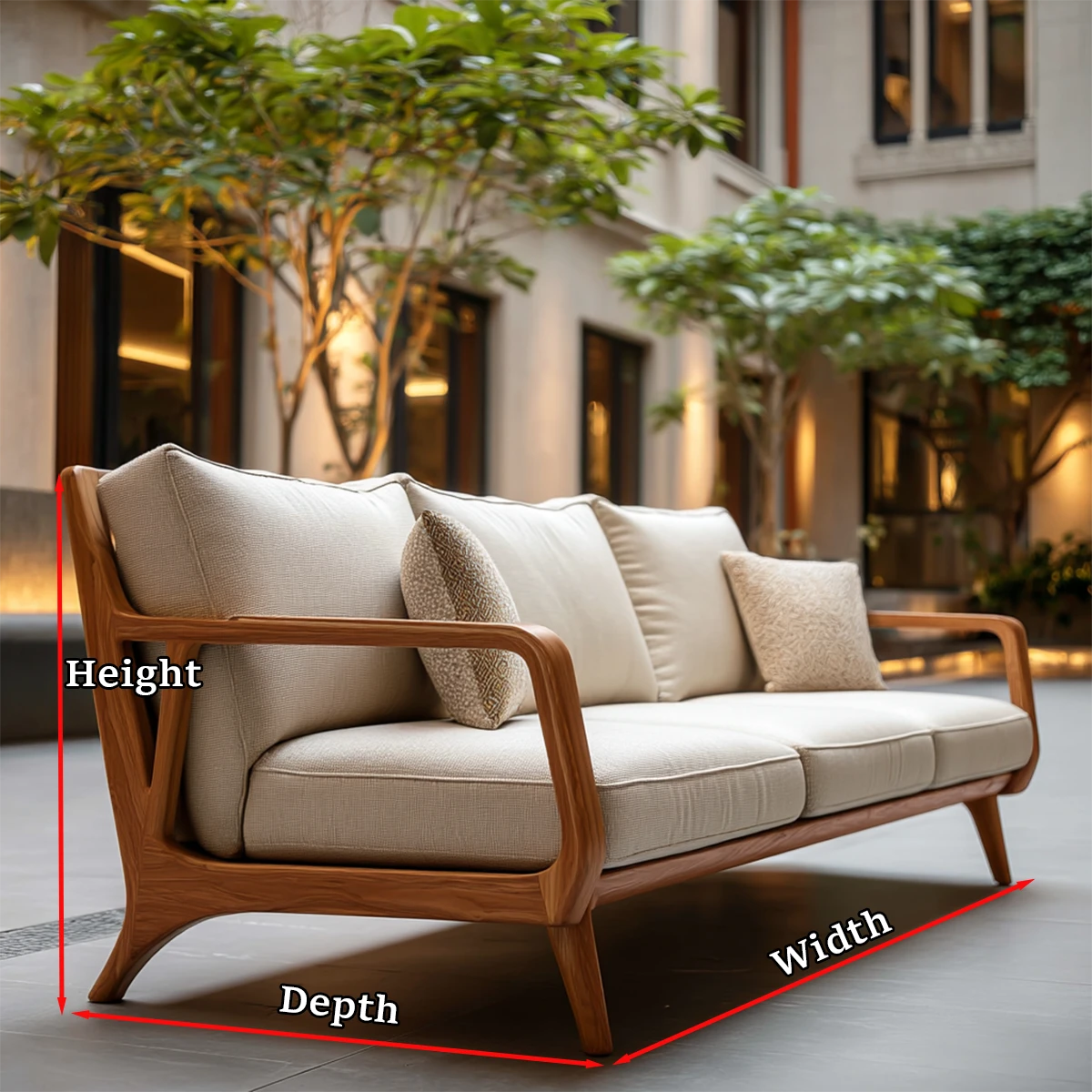 Premium upholstered sofa with sculpted wood frame and plush cushions in relaxed outdoor environment