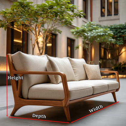 Premium upholstered sofa with sculpted wood frame and plush cushions in relaxed outdoor environment