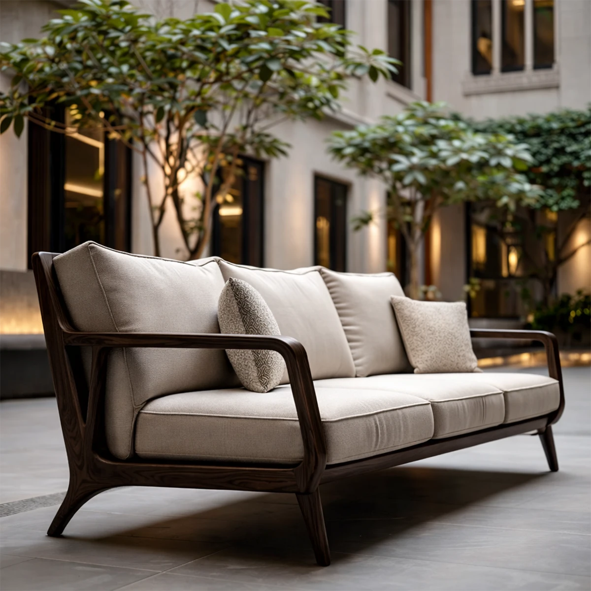 Sleek contemporary sofa with upholstered seating and handcrafted wood arms in modern patio design