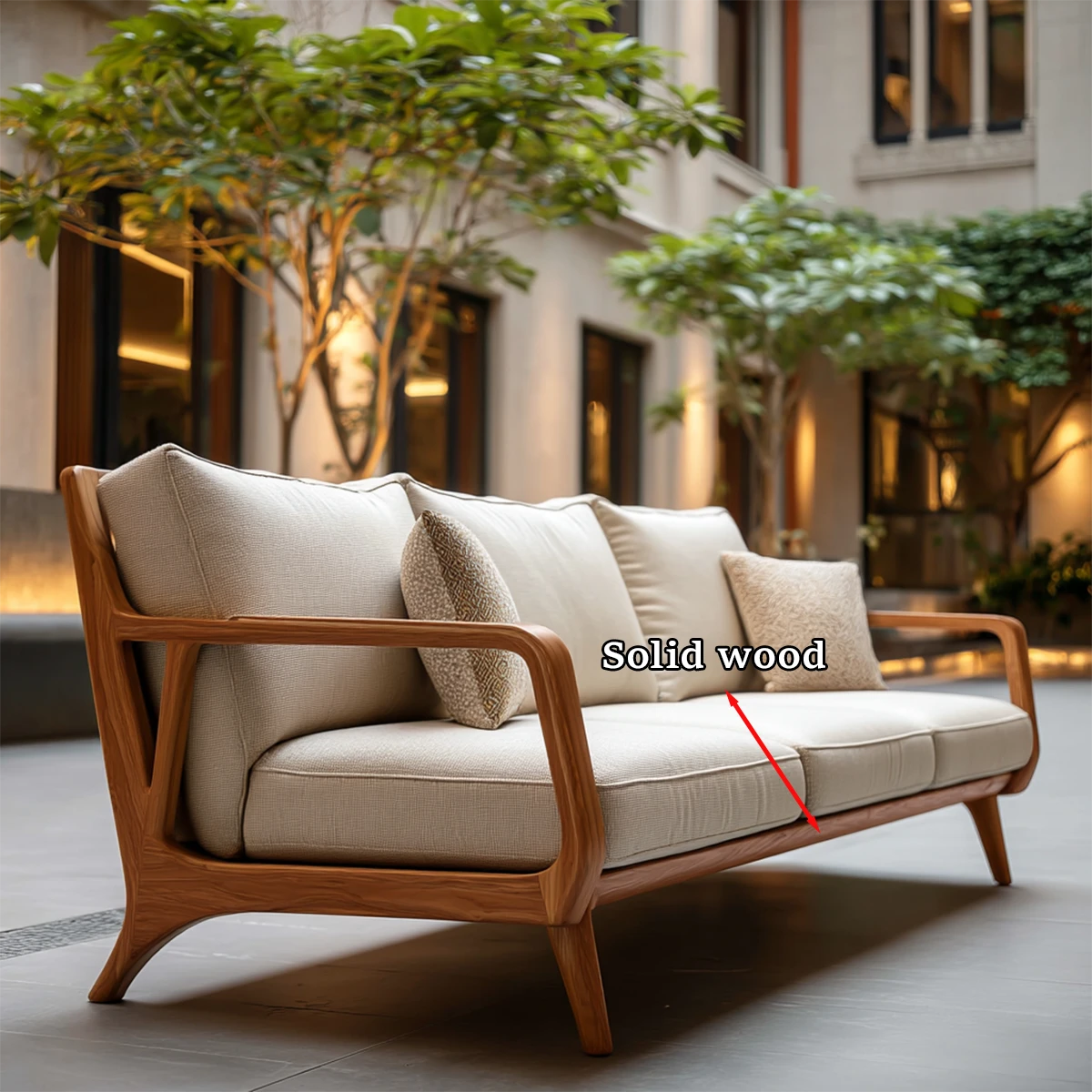 Refined modern sofa with light fabric upholstery and smooth wood detailing in open air setting