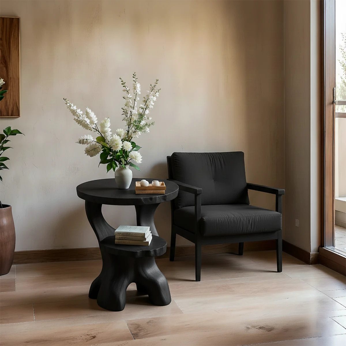 With its black color finish, the accent table blends organic curves and modern styling