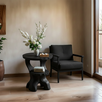 With its black color finish, the accent table blends organic curves and modern styling