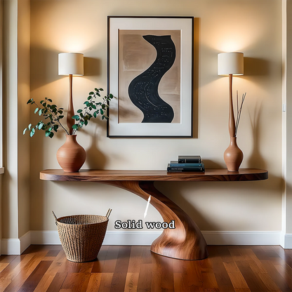 Warm neutral interior styled with a modern console table showcasing organic curves and texture