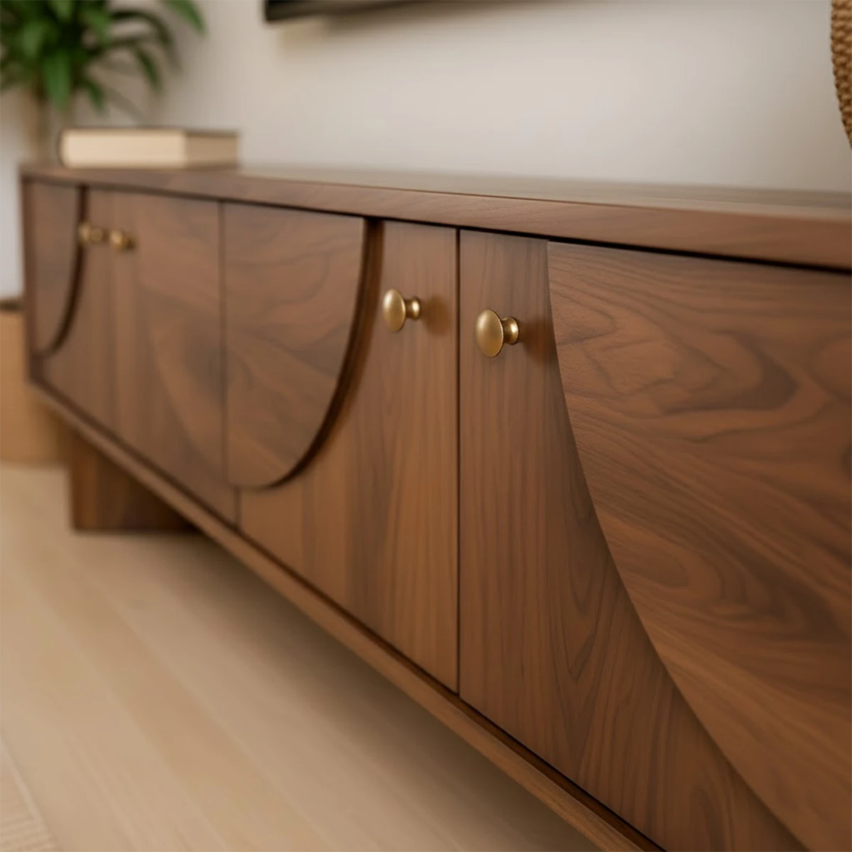Modern TV stand in soft brown finish with smooth surface and low profile in a bright interior