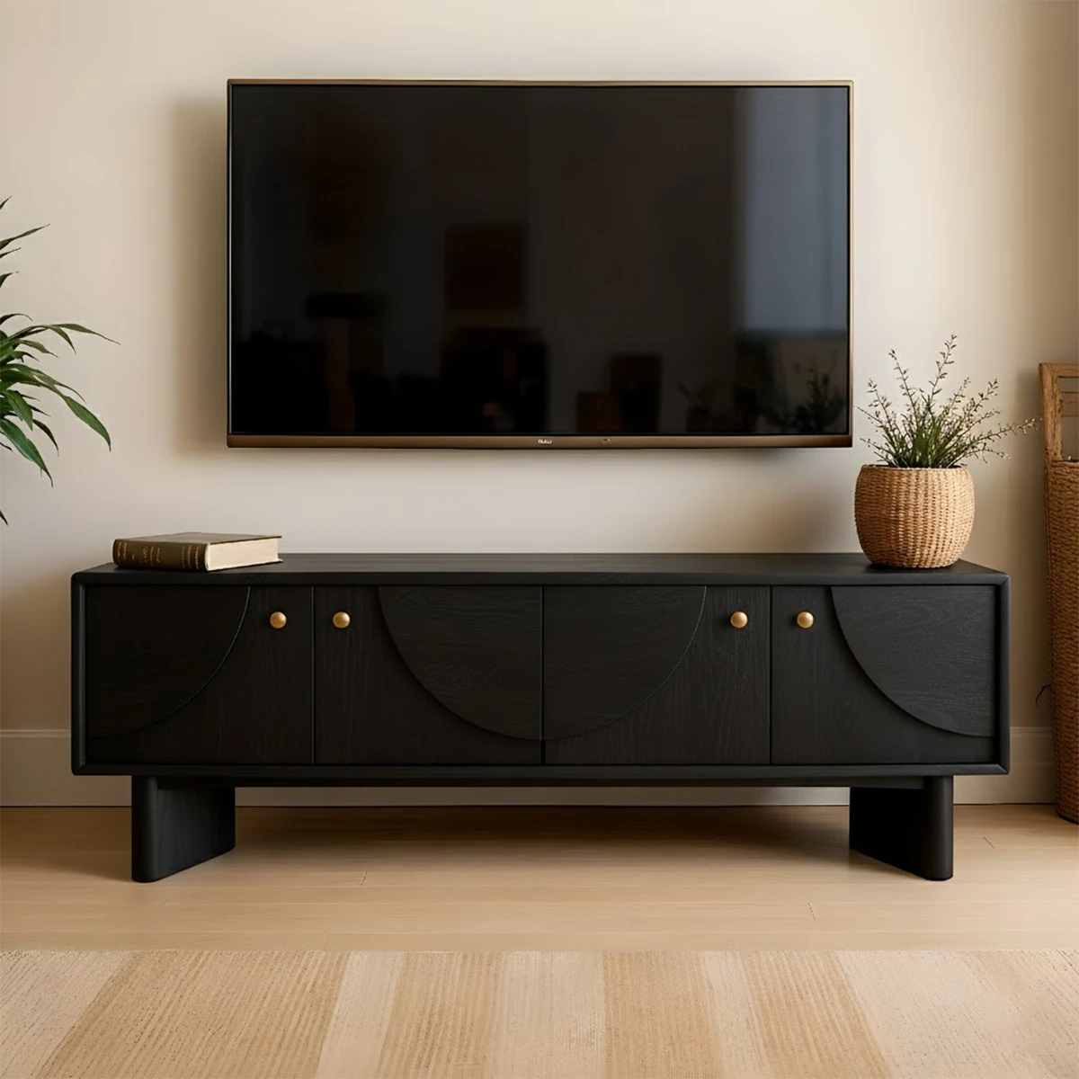Soft black TV stand with minimal form and smooth finish in a contemporary living room