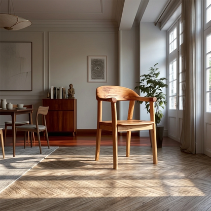 Modern solid wood dining chair with curved backrest and arm support in a bright interior setting