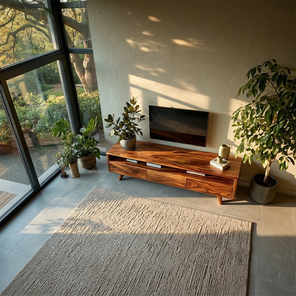 This mid century media console features clean lines, storage, and warm natural wood tones