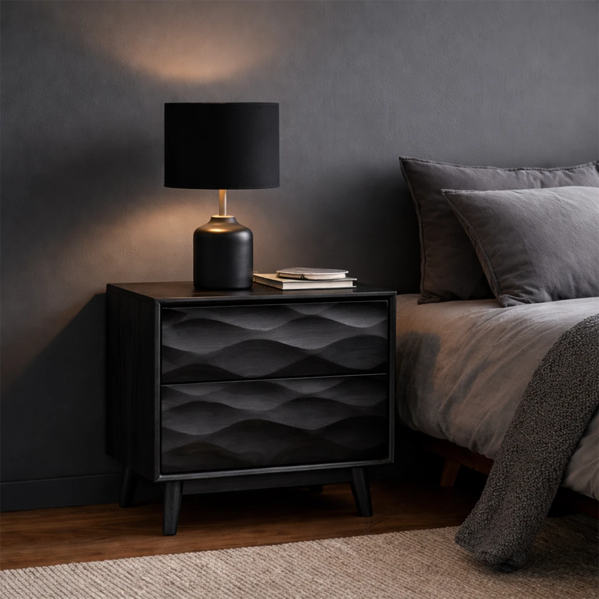 Functional bedside cabinet designed with modern carved styling and smooth black tone finish