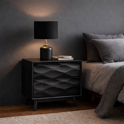 Functional bedside cabinet designed with modern carved styling and smooth black tone finish
