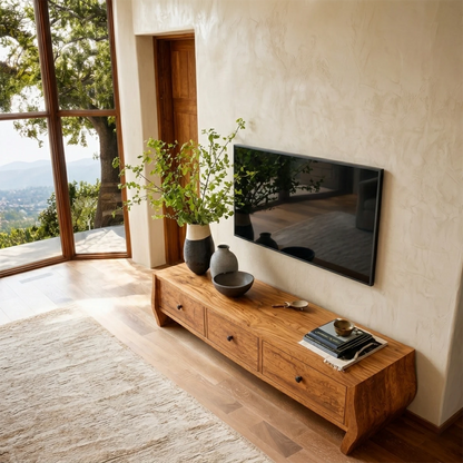 Long media cabinet with soft curved silhouette and refined natural wood finish styling
