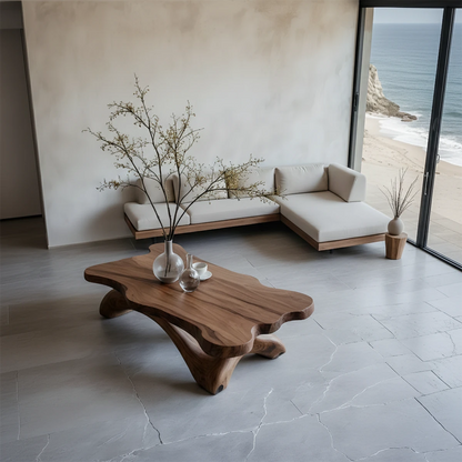 Walnut style coffee table with sculptural curved base and seamless top in a soft neutral home interior