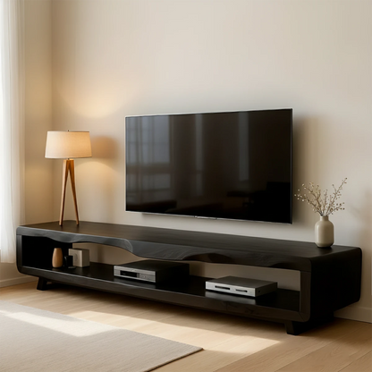 Warm black TV stand with low profile structure and practical storage in a bright modern room
