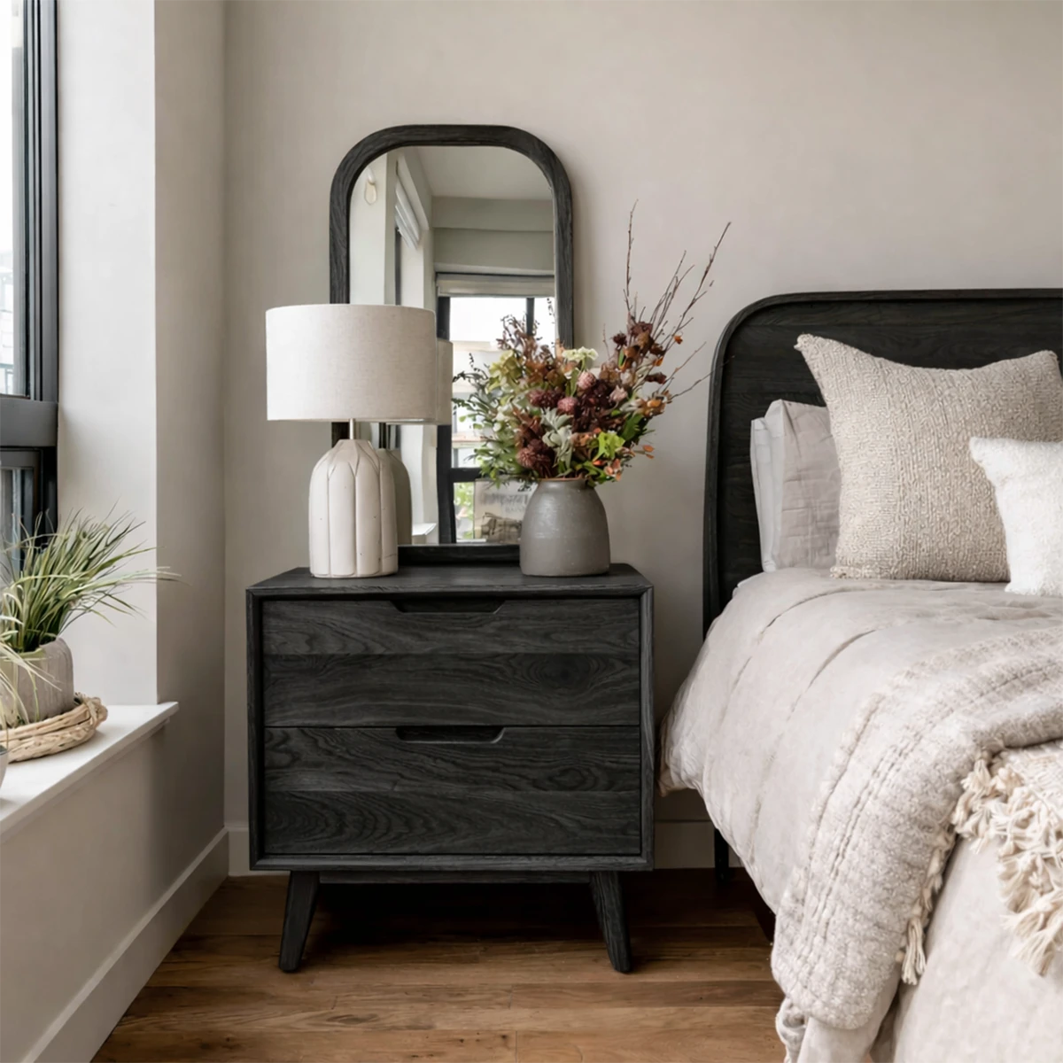 Compact bedside table designed with distinctive grain detail and refined black tone finish
