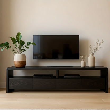 Modern TV stand with rich black tone and organic texture in a warm minimalist living room