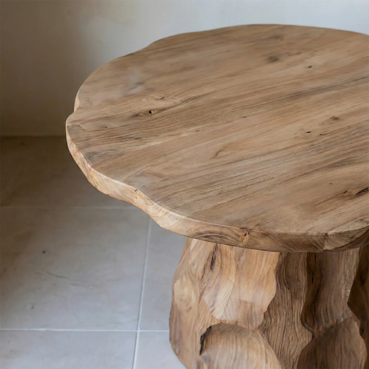 Designed with a walnut color finish, the end table offers a bold form and artistic detail