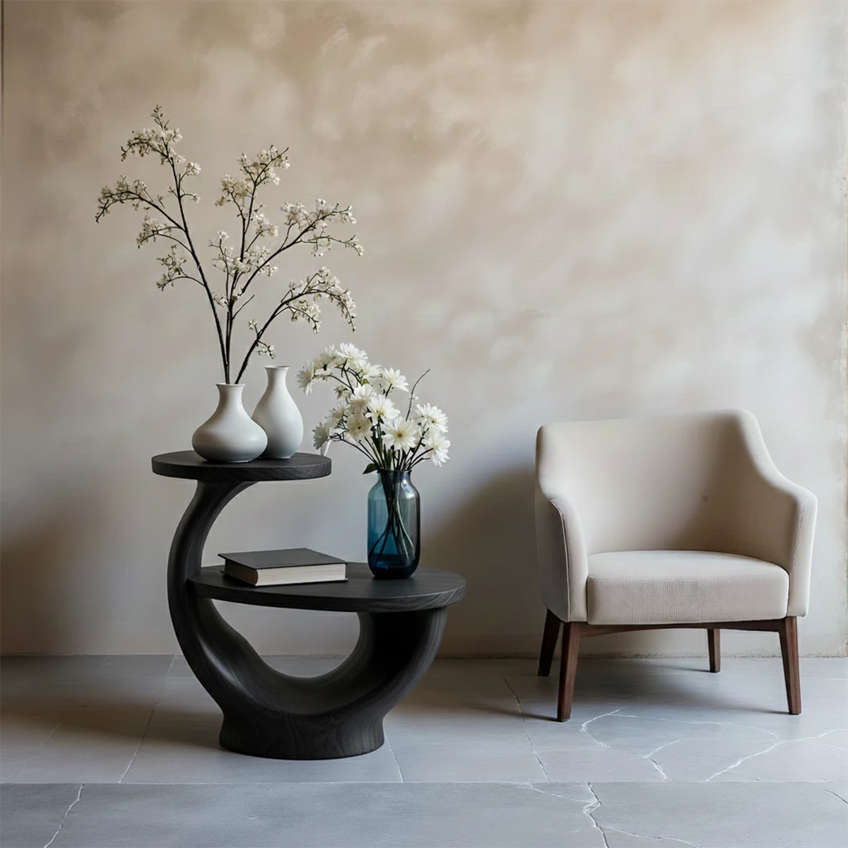 With its black tone finish, the end table blends organic shape and modern styling