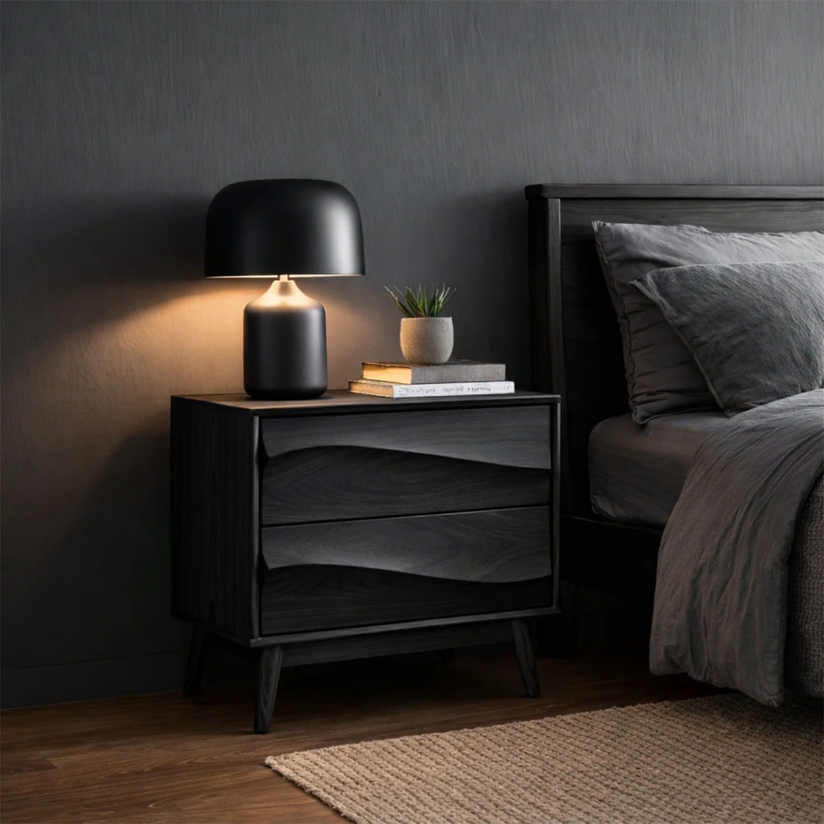 Minimalist bedside cabinet featuring subtle curved drawer fronts and elegant black tone finish